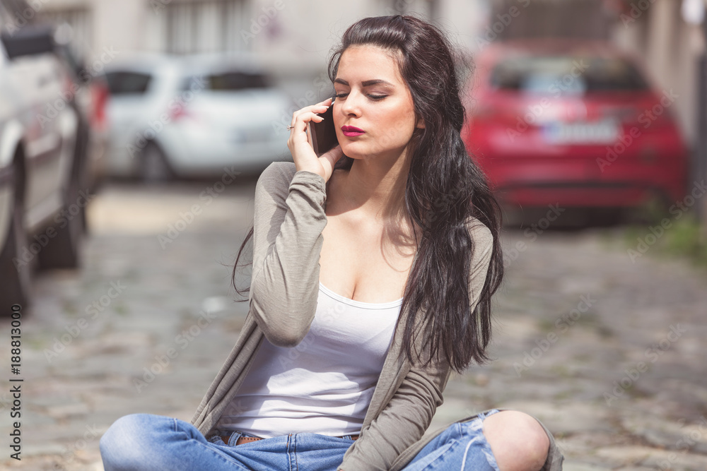 Cute urban girl talking on the phone. Cute urban girl talking on the phone.