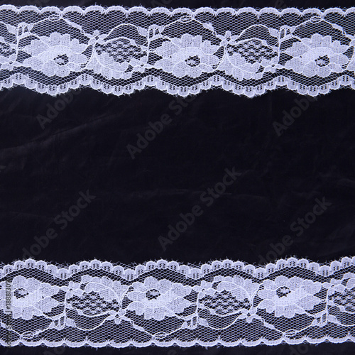 White lace on the black background