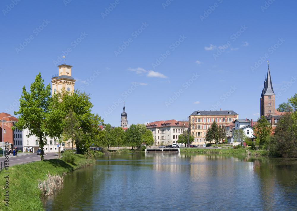 Altenburg / Germany: View over the „Little Pond“ to waterworks tower, St. Bartholomew steeple, Martin Luther School and the „Red Spires“