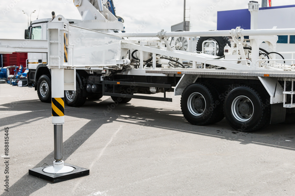 hydraulic outriggers of the crane installed on the truck. different