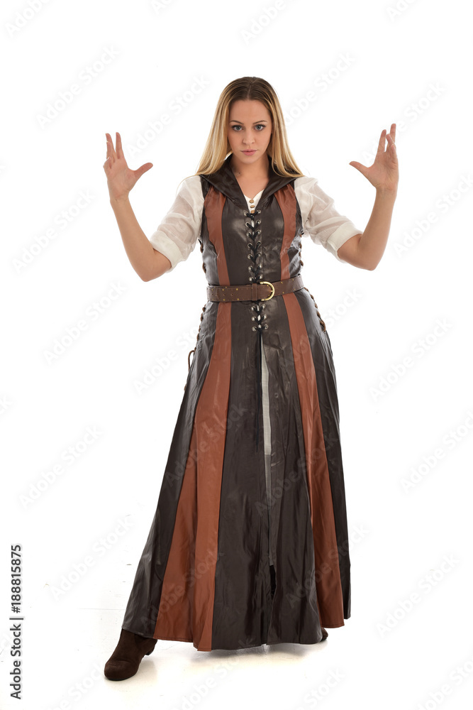 full length portrait of girl wearing brown fantasy costume. standing pose on white studio background. full length portrait of girl wearing brown fantasy costume. standing pose on white studio background.