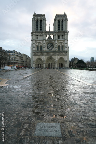Paris,France-January 19, 2018: Thanks to a rain shower, shadow of Notre Dame de Paris is recognizable on the surface of wet stone pavement.   © khunta