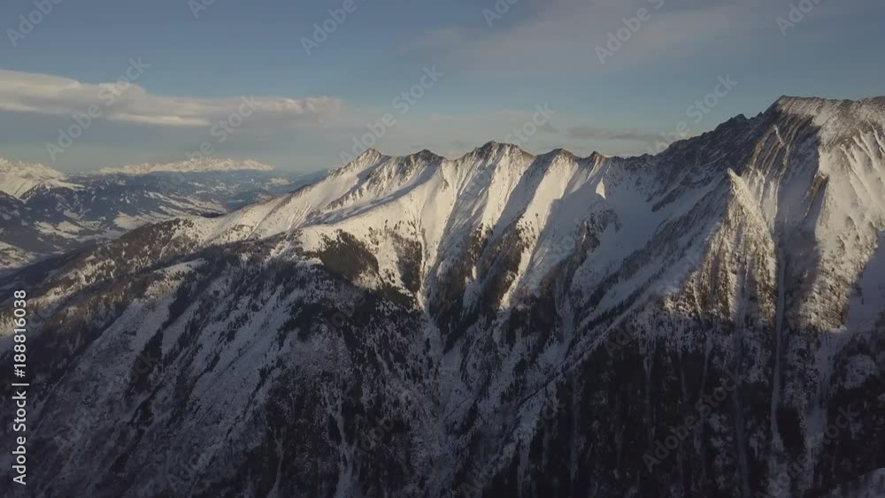 Aerial view of the Alps. Peaks of mountains in the snow in winter. Ski resort in Austria. Natural backround Aerial view of the Alps. Peaks of mountains in the snow in winter. Ski resort in Austria. Natural backround