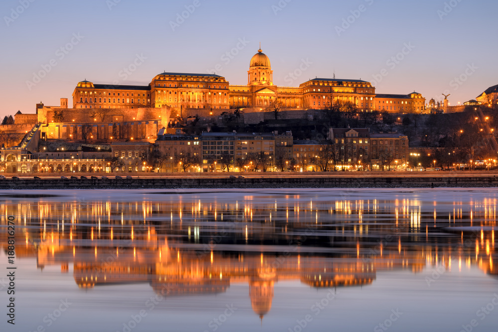 Illuminated Royal Palace in Budapest reflected in Danube river at night