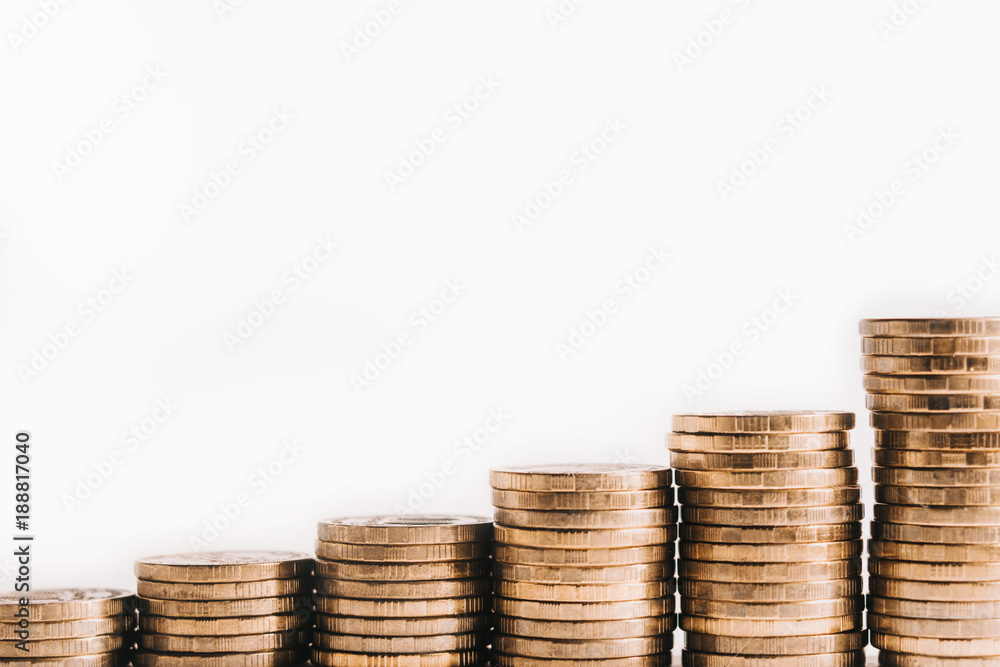 A pile of gold coins, ascending. The growth of finance. Isolated white background. A pile of gold coins, ascending. The growth of finance. Isolated white background.