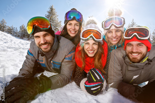 Group of young skiers together on winter