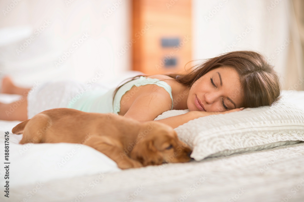 Cute puppy pet with mistress sleep on the pillow Cute puppy pet with mistress sleep on the pillow