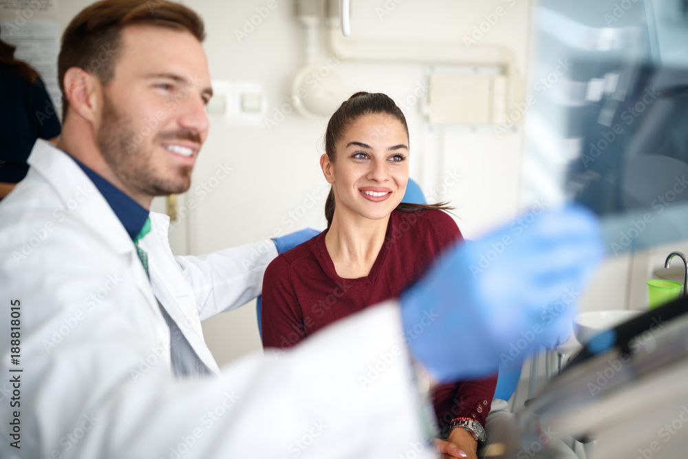 Fototapeta premium Girl in dental clinic with dentist