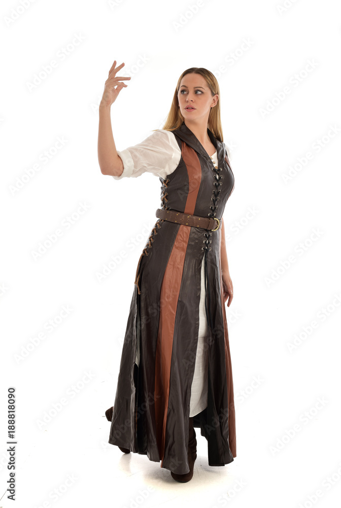 full length portrait of girl wearing brown  fantasy costume. standing pose on white studio background. 