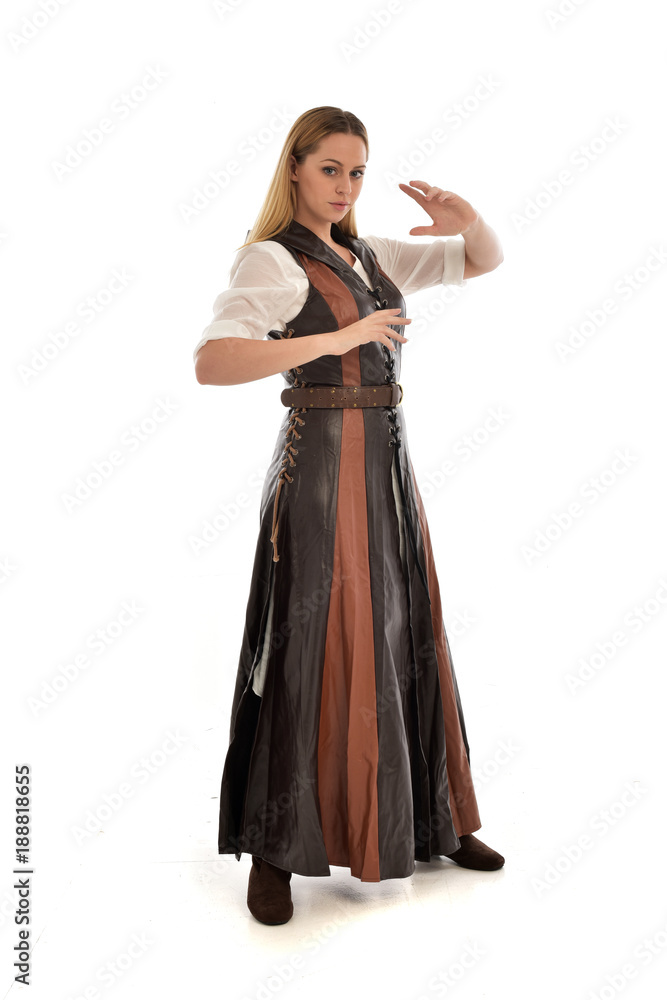full length portrait of girl wearing brown fantasy costume. standing pose on white studio background. full length portrait of girl wearing brown fantasy costume. standing pose on white studio background.