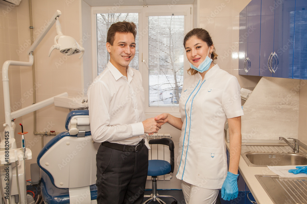 A woman doctor dentist in the office communicates with the patient. Stomatology. Medicine. A woman doctor dentist in the office communicates with the patient. Stomatology. Medicine.
