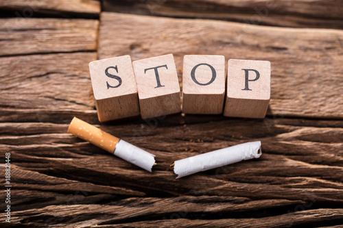 Cigarette And Wooden Blocks Showing Stop Word