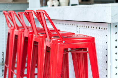 Modern metal red chair with marble counter
