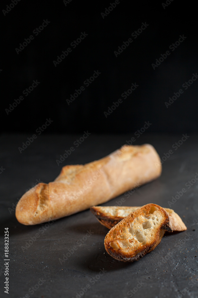 baguette with toast on a dark background