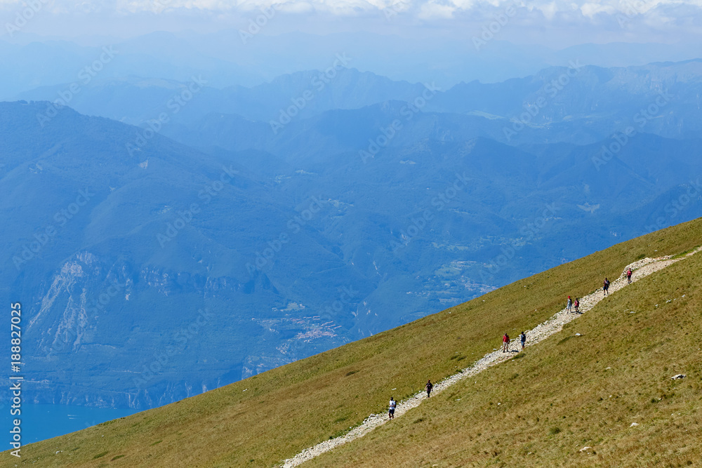 Mount Baldo, Italy - August 15, 2017: walking mountain tourism. people climb the mountain.