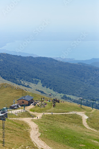 Lake Garda. Monte Baldo. Italy. - August 15, 2017: tourists at the top of the mountain in a cafe.