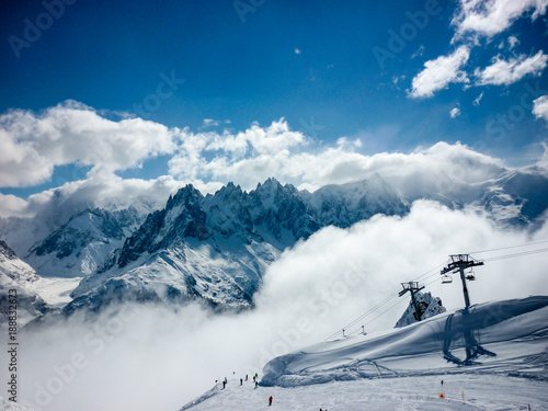 A view across the French Alps on a clear, snowy day