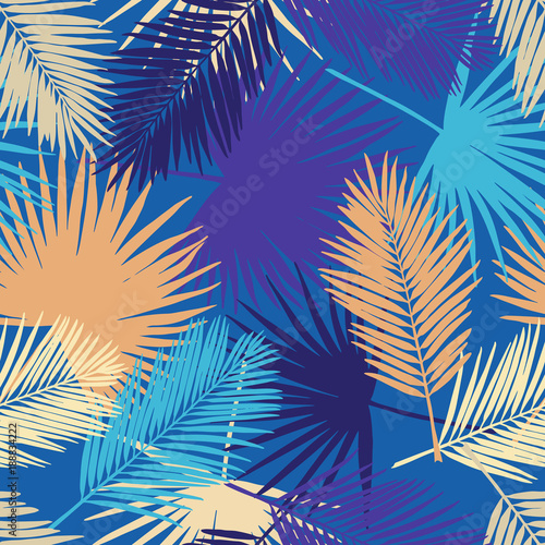 Seamless floral pattern with stylized fan and silk palm leaves. Jungle foliage, lilac and yellow hues on blue background. Textile design.