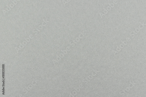 Gray cardboard sheet abstract texture or background.