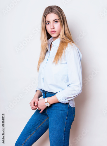 beautiful young woman in casual outfit wearing wrist watch