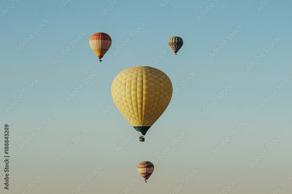 Fototapeta premium Hot air balloons flying in blue sky