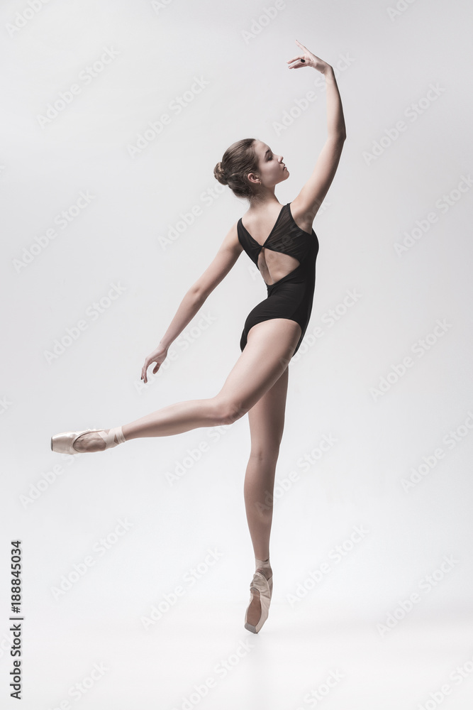 Young classical dancer isolated on white background.