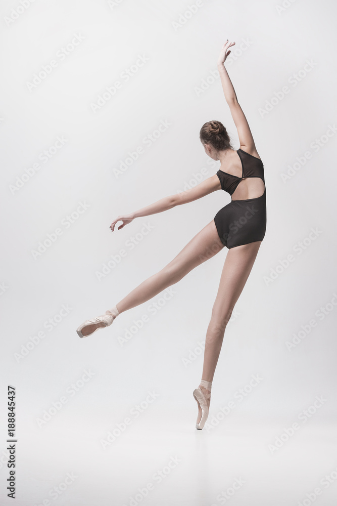 Young classical dancer isolated on white background.