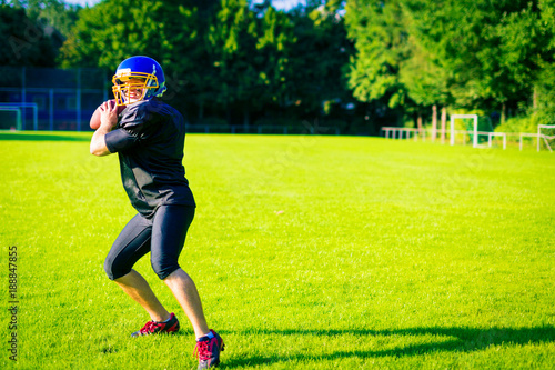 American Football Player Throwing The Ball