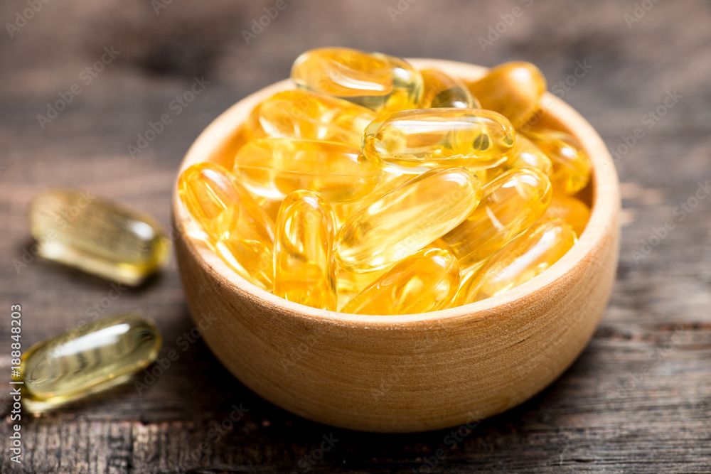 Fish oil capsules with omega 3 and vitamin D. healthy diet concept. Fish oil capsules with omega 3 and vitamin D. healthy diet concept.