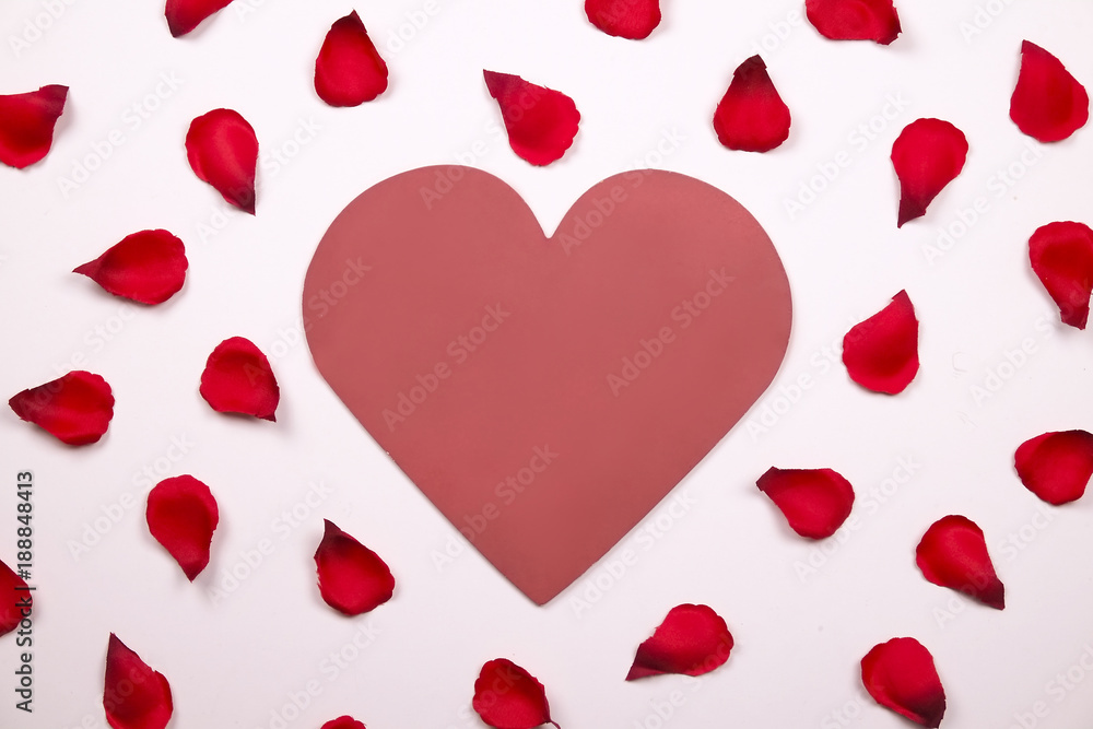 Beautiful bright red rose petals on solid white background. Happy valentines day oliday sales concept.