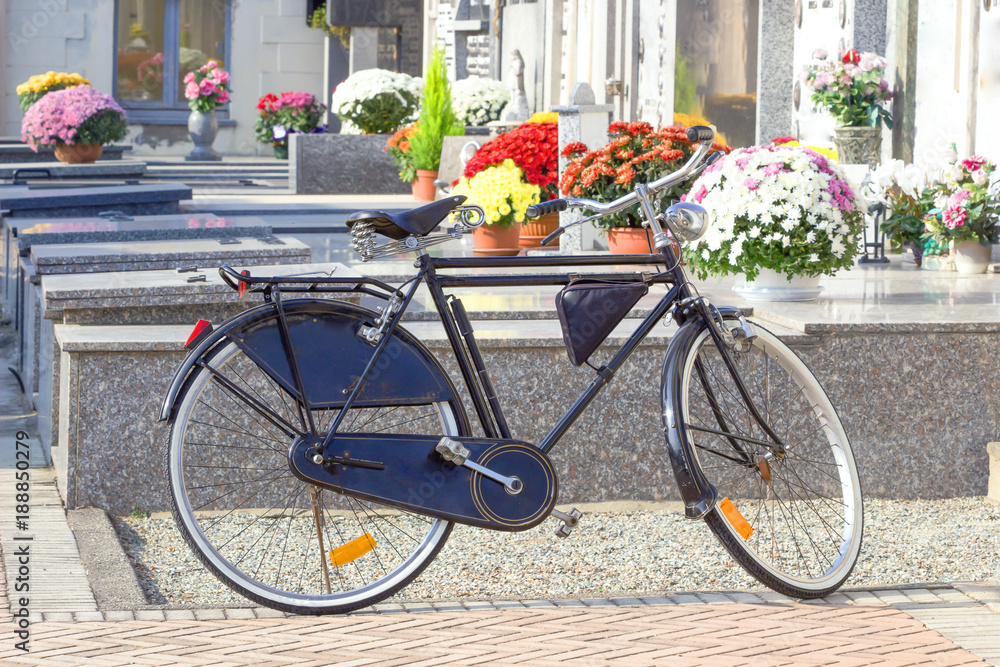 close up of bike parking at cemetery in nature background.