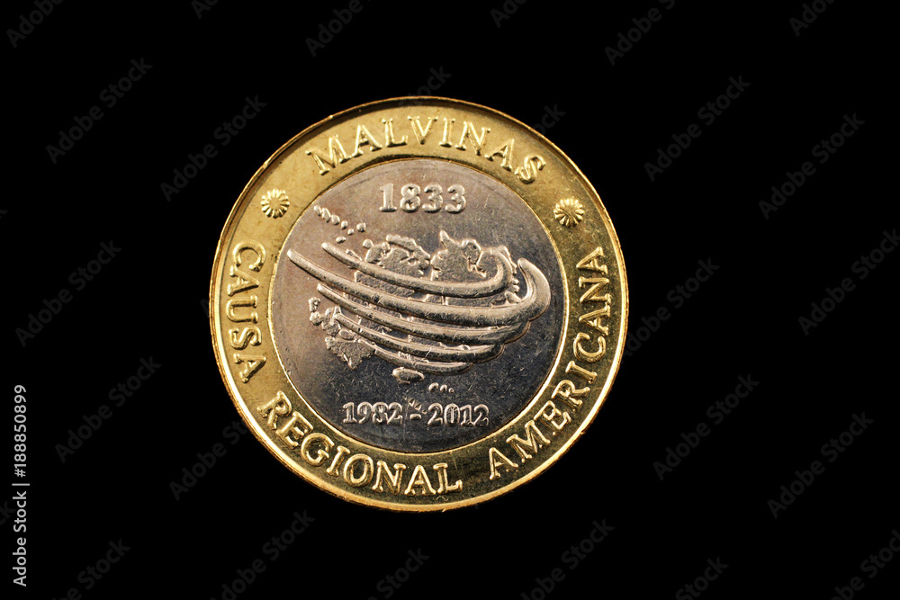 A bimetallic two peso coin from Argentina isolated on a black background A bimetallic two peso coin from Argentina isolated on a black background