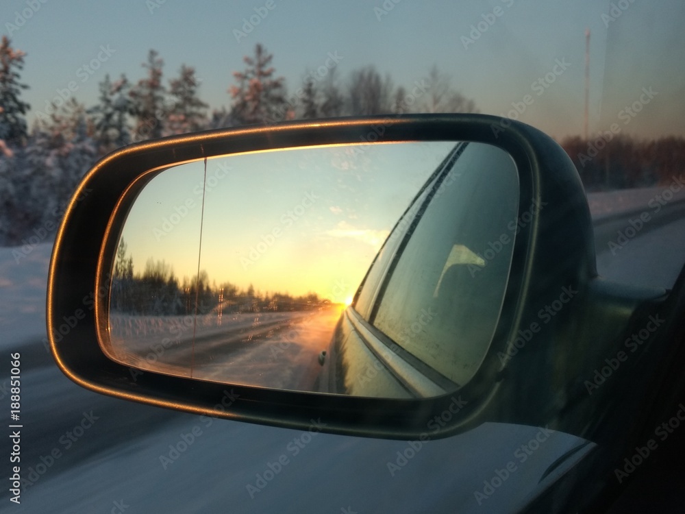 Reflection in car's mirror