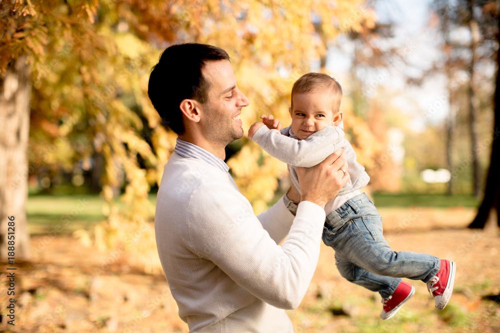 Young father and baby boy in autumn park Young father and baby boy in autumn park