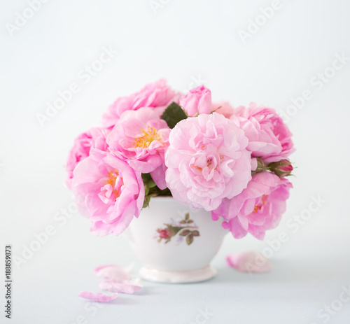 Bouquet of  pink roses on light grey background. © Antonel