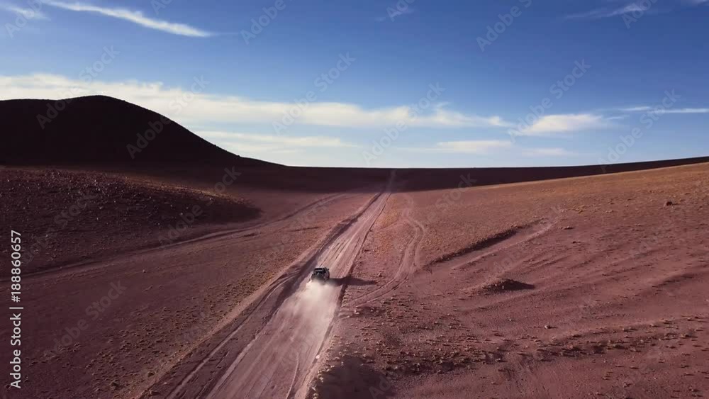 Aerial view of off-road truck riding in a dirt road Aerial view of off-road truck riding in a dirt road