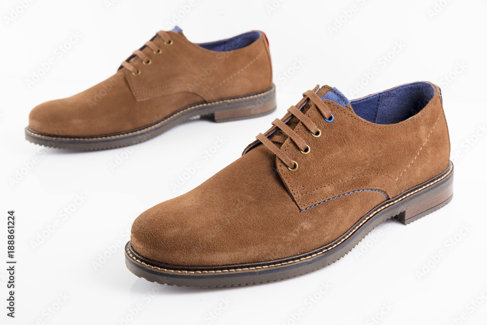 Male brown leather shoe on white background, isolated product, comfortable footwear. Male brown leather shoe on white background, isolated product, comfortable footwear.