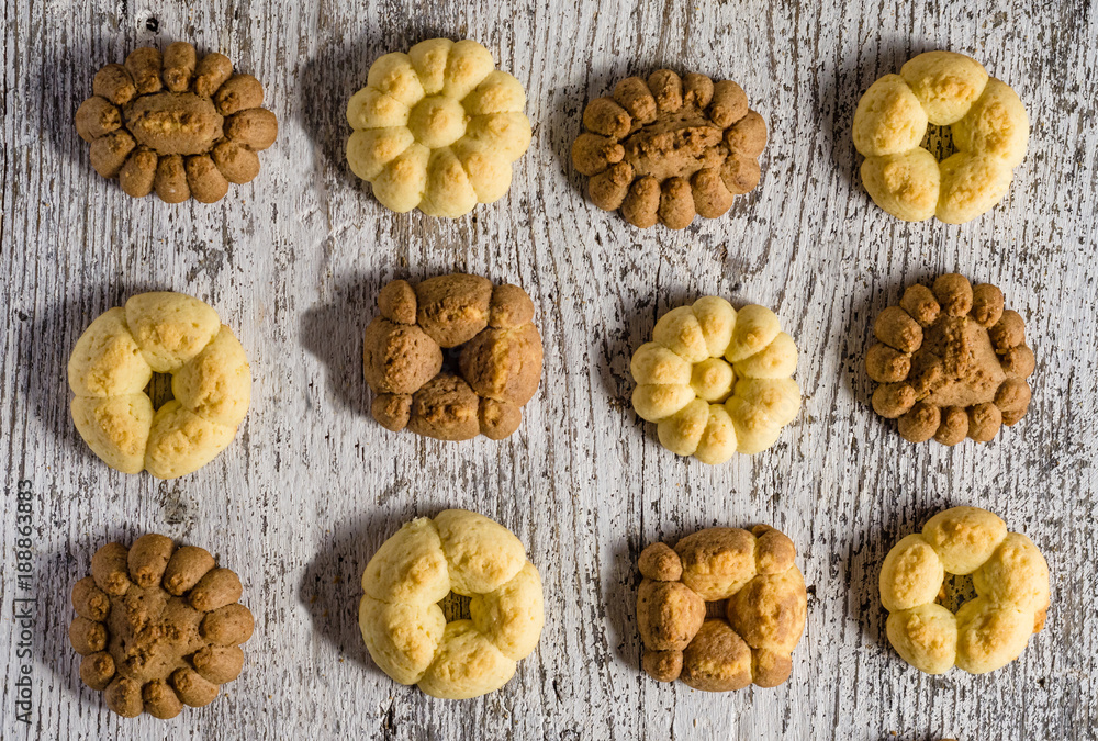 Homemade brown and yellow tasty tea biscuits - top view Homemade brown and yellow tasty tea biscuits - top view