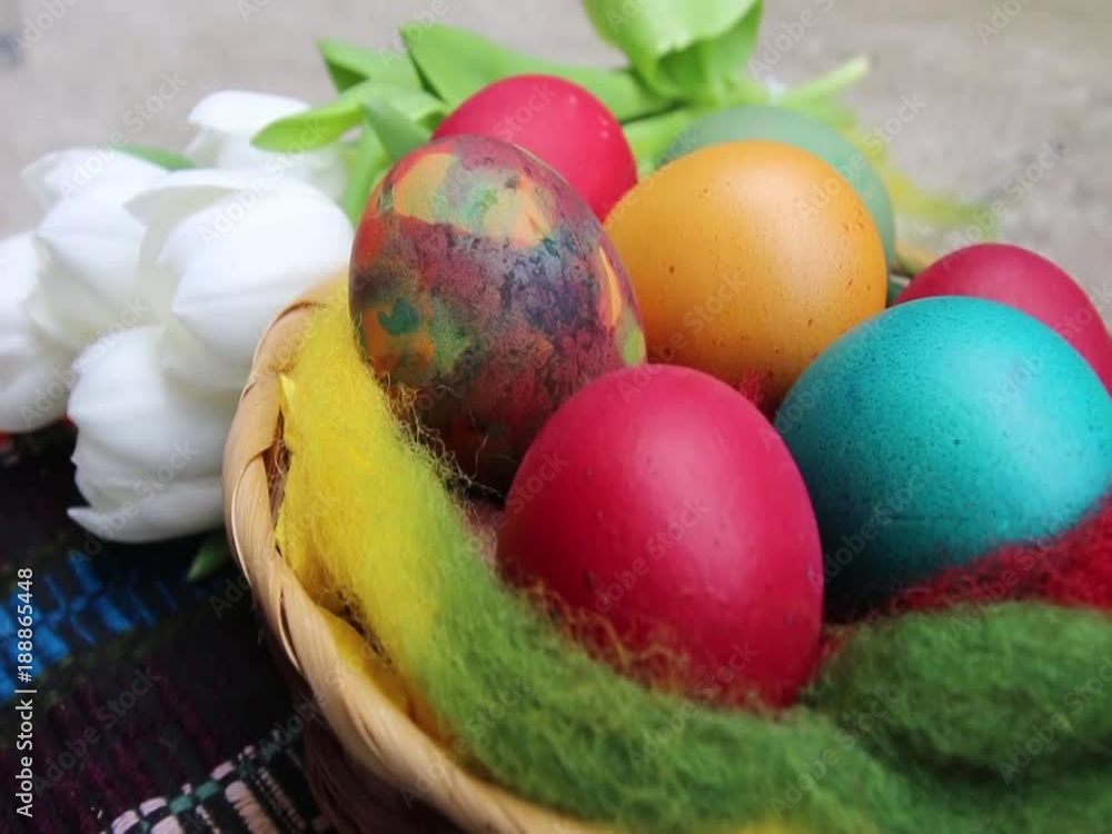 Close up of colorful painted easter eggs in a basket - hd video Close up of colorful painted easter eggs in a basket - hd video