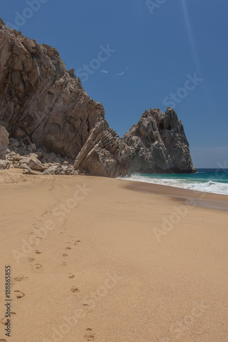 Footsteps in the sand at Lovers Beach in Cabo San Lucas, Mexico