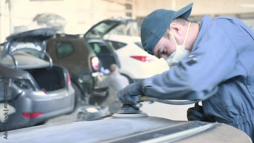 auto repairman grinding autobody bonnet auto repairman grinding autobody bonnet