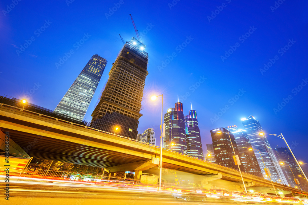 Cityscape of Beijing at night. Skyscraper is under construction. Located near Jintaixizhao Station of Beijing Subway.