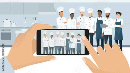 Professional chefs posing in the restaurant kitchen