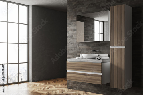 Black and wooden bathroom corner