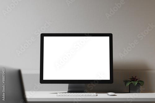 White computer screen on a wooden table white