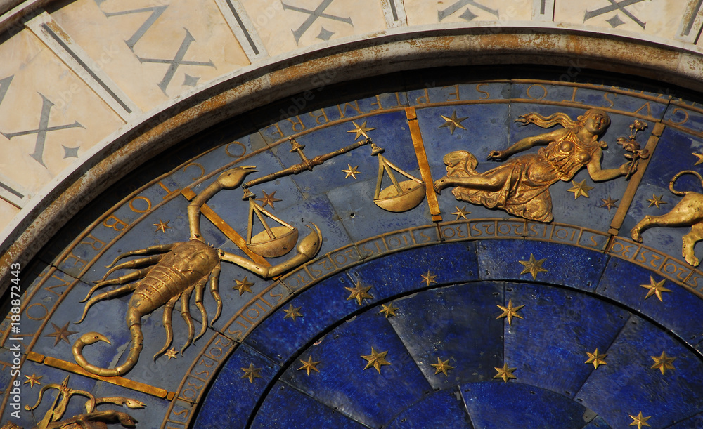 Horoscope and Astrology. Detail of Saint Mark Square renaissance Clock Tower in Venice with zodiac signs Scorpio, Libra Virgo, planet and stars (15th century)