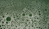 Green bubbles and foam, texture and pattern, made from cleaning products, closeup macro