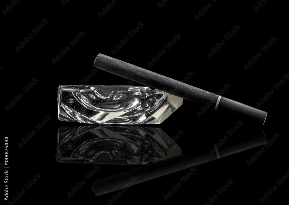 custom made wallpaper toronto digitalSingle Kretek black clove cigarrete on a glass ashtray, black background and reflective surface.