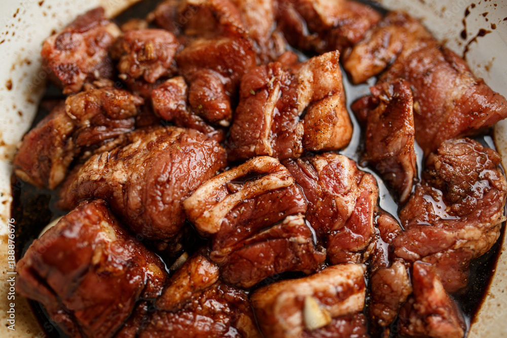 Fresh pork ribs marinated in the garnet sause narsharab. Close up.