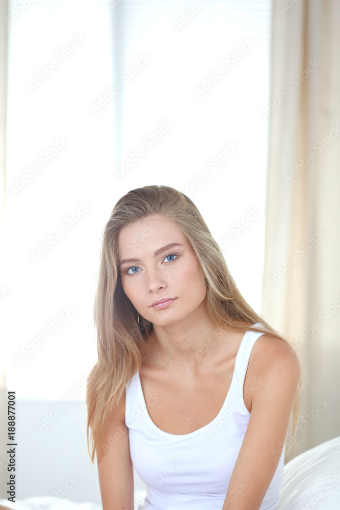 Beautiful woman showing heart shape on her hand , sitting bed. Beautiful woman Beautiful woman showing heart shape on her hand , sitting bed. Beautiful woman
